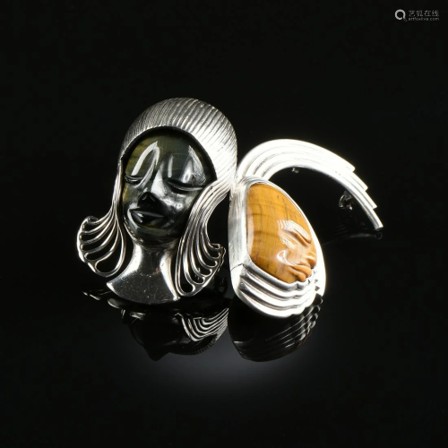 A PAIR OF MEXICAN STERLING SILVER AND TIGER'…