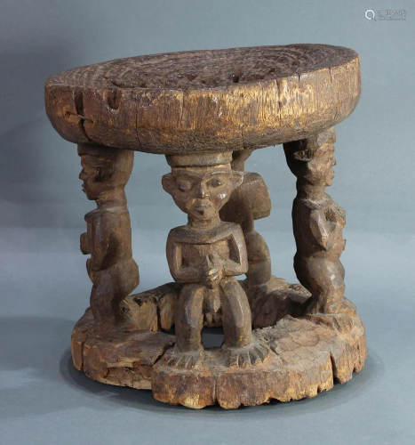 Cameroon carved wood stool with four figures