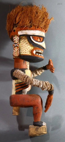 A Malanggan carved wood figure with orange ra…