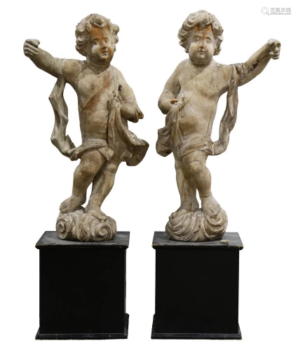 A pair of continental Baroque wood carved putti l…