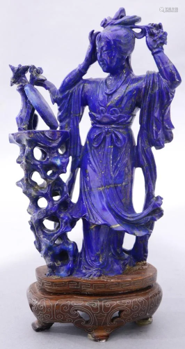 A Chinese Lapis Lazuli Figure of Beauty Looking At A