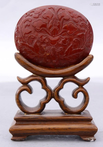 A Chinese Amber Pendant, Carved in Low Relief…