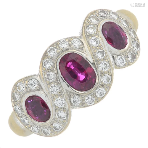 An 18ct gold ruby three-stone ring, with diamond