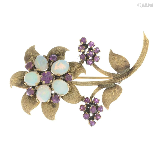 A mid 20th century opal and ruby floral brooch. …