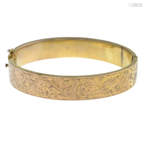 An early 20th century 9ct gold hinged bangle.Hallm…