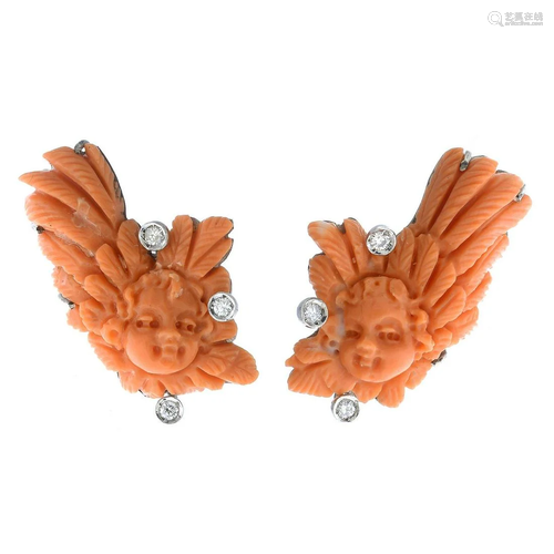 A pair of carved coral earrings, with brilliant-cut