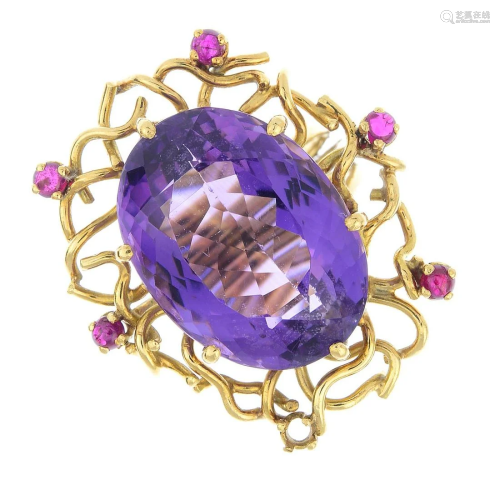 An amethyst and ruby dress ring. One ruby