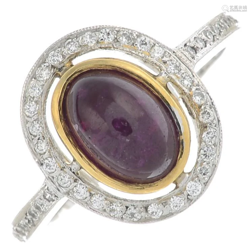An 18ct gold cabochon ruby and diamond ring.Ruby
