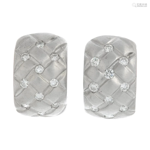 A pair of brilliant-cut diamond hoop earrings.Estim…