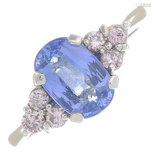 A platinum sapphire and 'pink' diamond ring.Sapphire