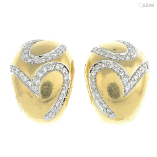 A pair of 18ct gold diamond earrings. Estimated t…