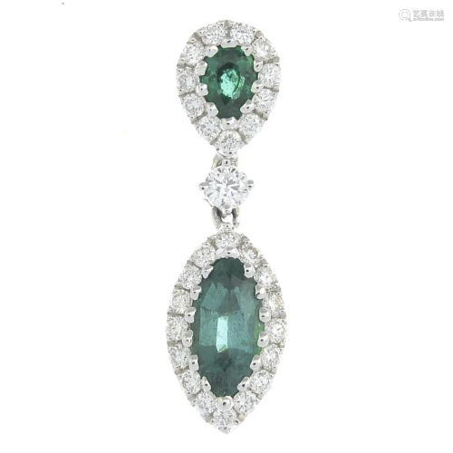 A brilliant-cut diamond and emerald pendant.Total