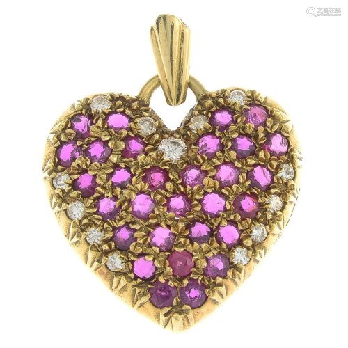 An 18ct gold, ruby and diamond pendant.Estimated t…