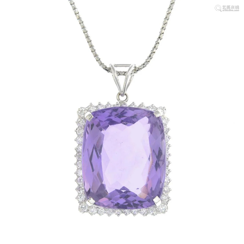 An amethyst and diamond pendant, suspended…