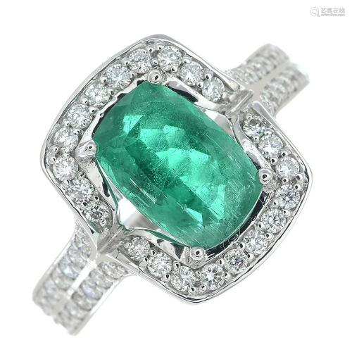 An emerald and brilliant-cut diamond dress ring.Emer…