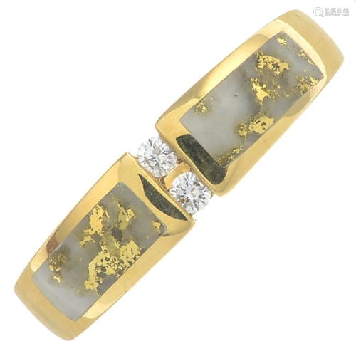 An 18ct gold quartz and diamond dress ring.Hall…