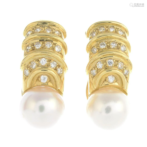 A pair of cultured pearl and diamond earrings.Cultured