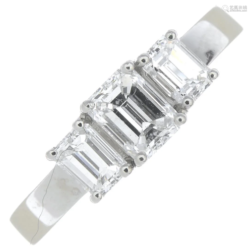 A platinum rectangular-shape diamond three-stone ri…