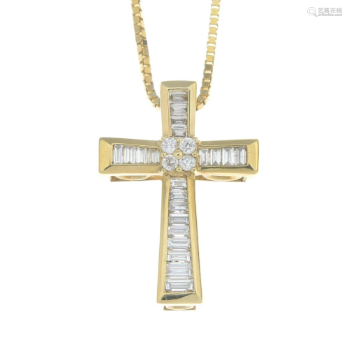 An 18ct gold diamond cross pendant, suspended fro…