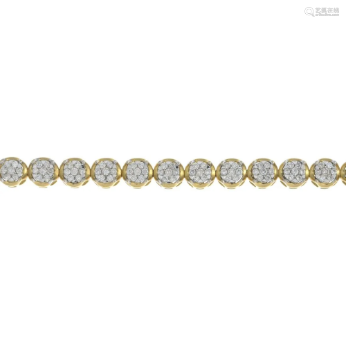A diamond cluster line bracelet.Total diamond weight