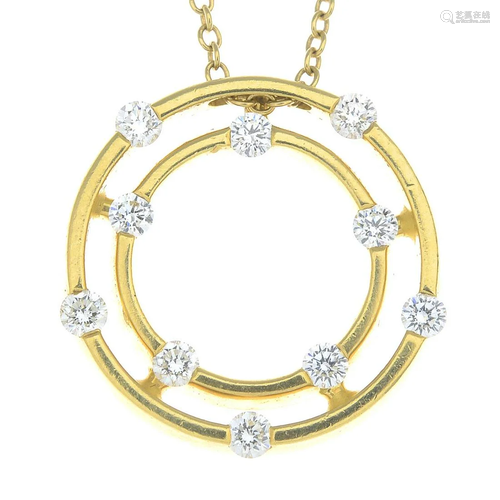 A brilliant-cut diamond pendant, suspended from a