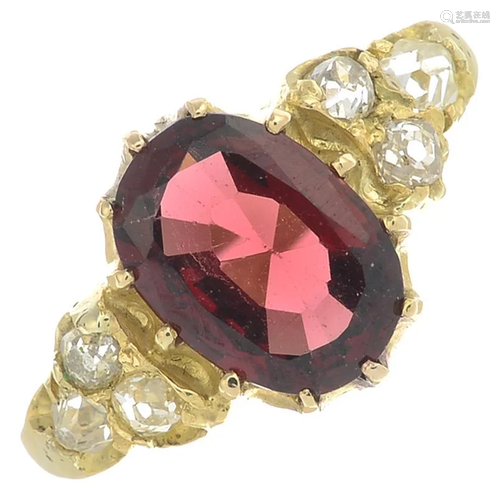 A garnet and diamond ring.Garnet weight