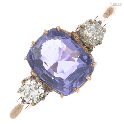 A Sri Lankan sapphire and diamond three-stone ring.