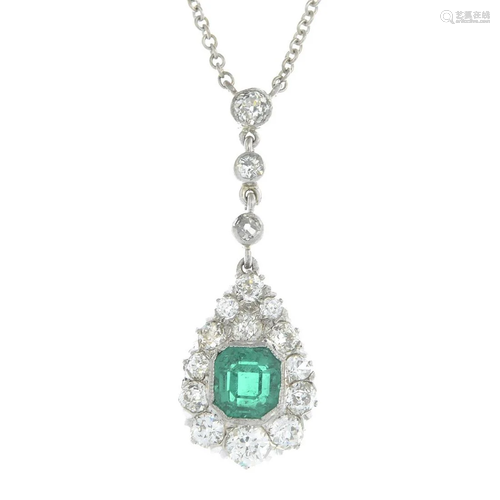 An emerald and diamond pendant, suspended…