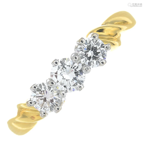 An 18ct gold brilliant-cut diamond three-stone ring.