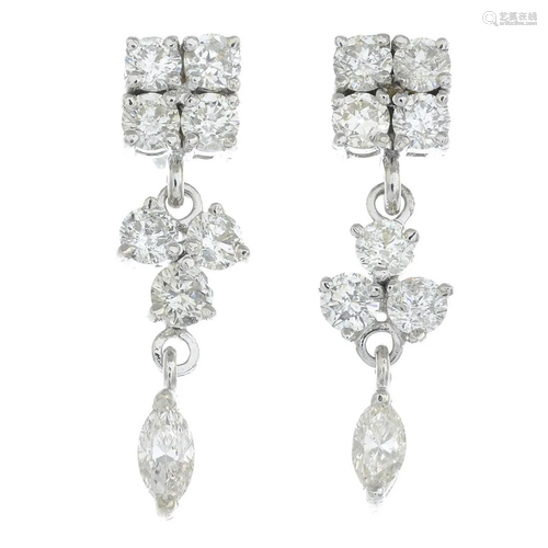 A pair of diamond earrings.Total diamond weight