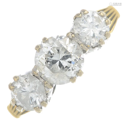 A brilliant-cut diamond three-stone ring.Band