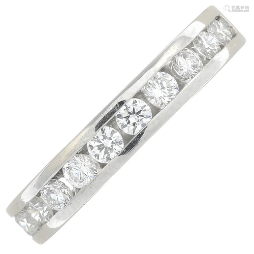 A platinum diamond half eternity ring. Estimated total