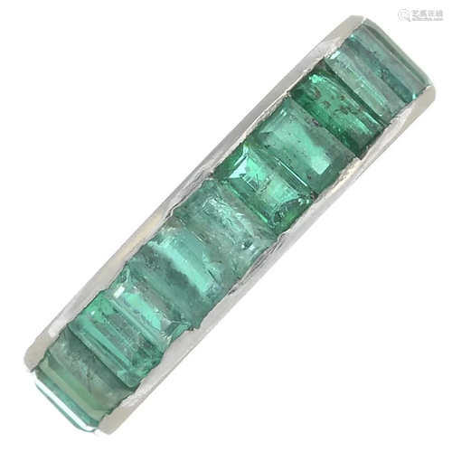 An emerald full eternity ring.Ring size I1/2. 4gms.