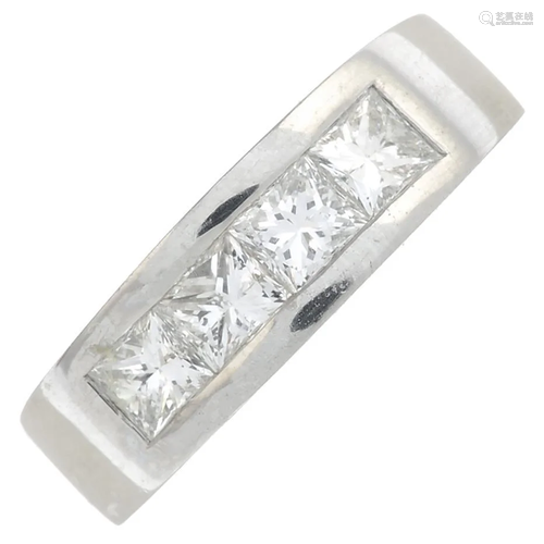 A platinum square-shape diamond ring. Total diamond