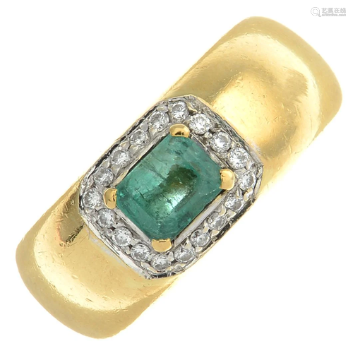 An emerald and diamond dress ring.Estimated…