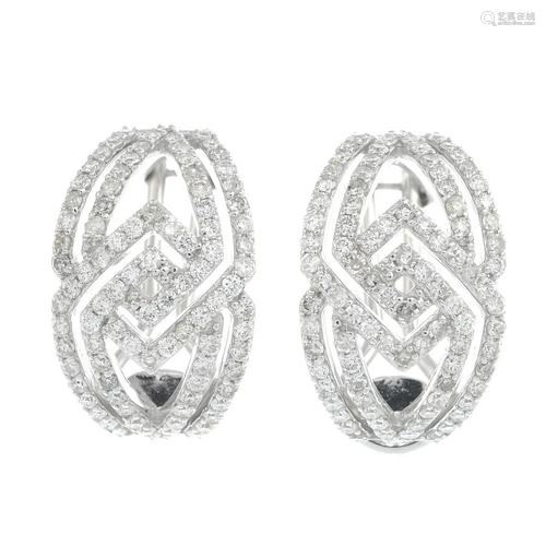 A pair of brilliant cut diamond earrings.Estimated