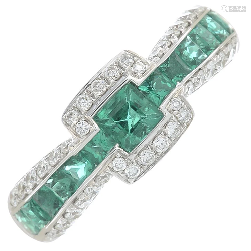 A brilliant-cut diamond and emerald dress ring.Total