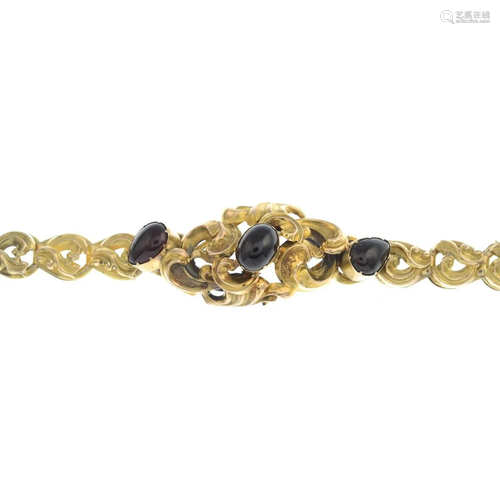 A mid 19th century gold garnet bracelet.Length 18cms.