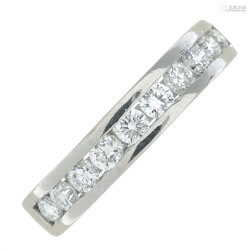 A platinum brilliant-cut diamond half eternity ring.