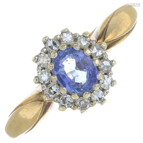 A 9ct gold sapphire and diamond cluster ring.Hallmarks