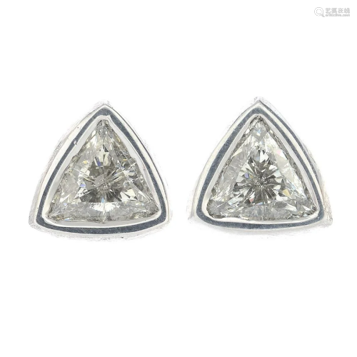 A pair of triangular-shape diamond collet earrings.