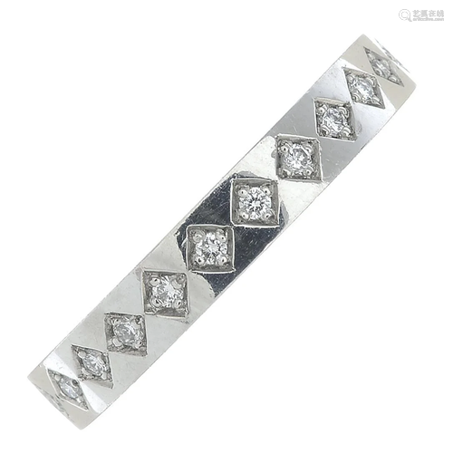 A platinum brilliant-cut diamond band ring.Estimated