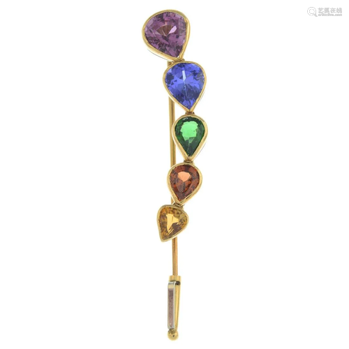 A gem-set tie pin, gems include garnet, tanzanite,