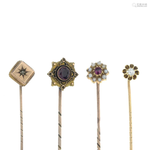 Four early 20th century gold gem-set stickpins.Gems