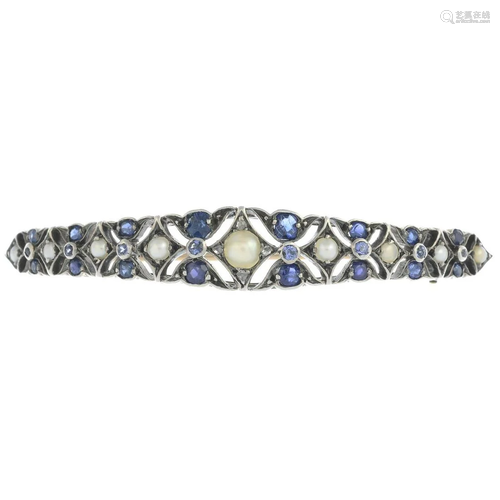 An early 20th century silver and gold, sapphire, split