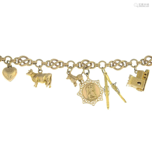 A fancy-link bracelet, suspending nine 9ct gold