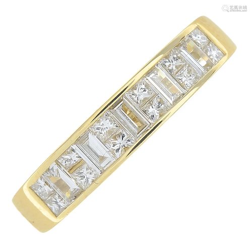 An 18ct gold vari-cut diamond half eternity ring.