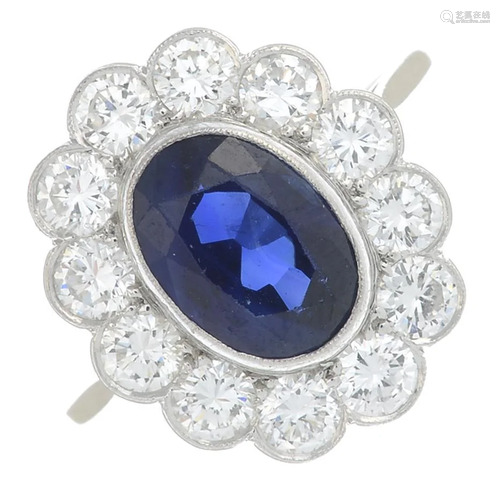 A sapphire and diamond cluster ring. Sapphire