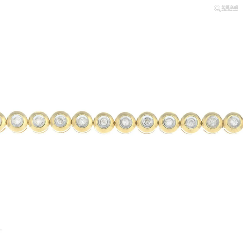 A diamond collet line bracelet.Total diamond weight