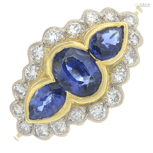 An 18ct gold sapphire three-stone ring, with diamond